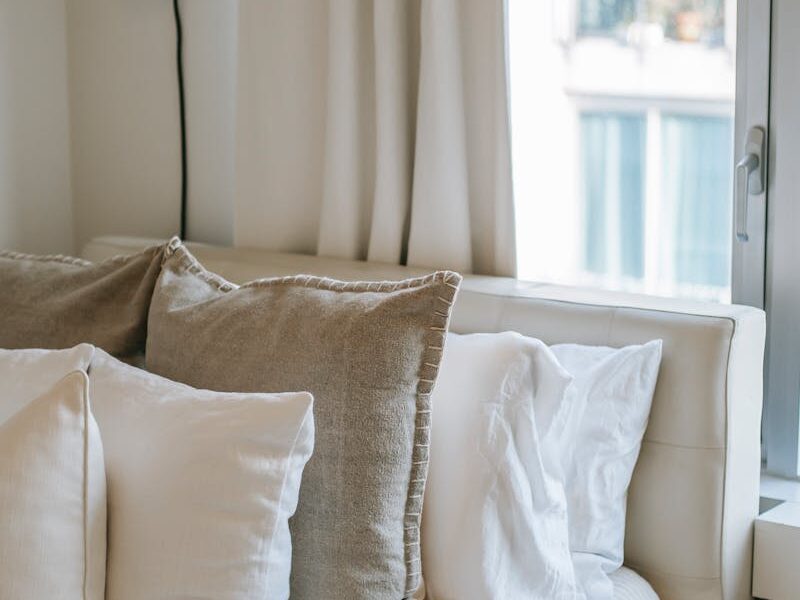 Bedroom interior with soft cushions on bed at home