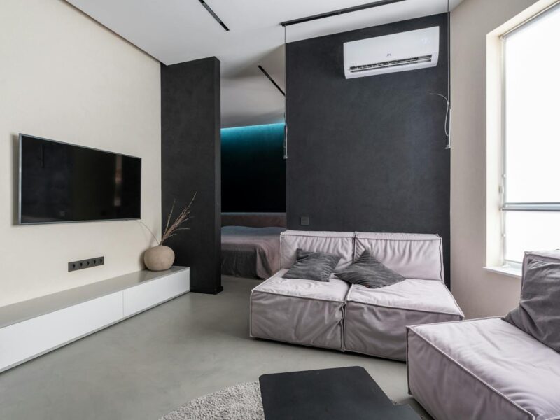 Cozy living room with sofas and TV set