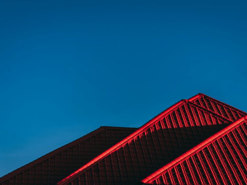 red and black building under blue sky