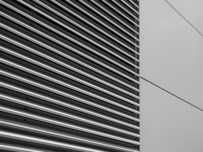 a black and white photo of the side of a building