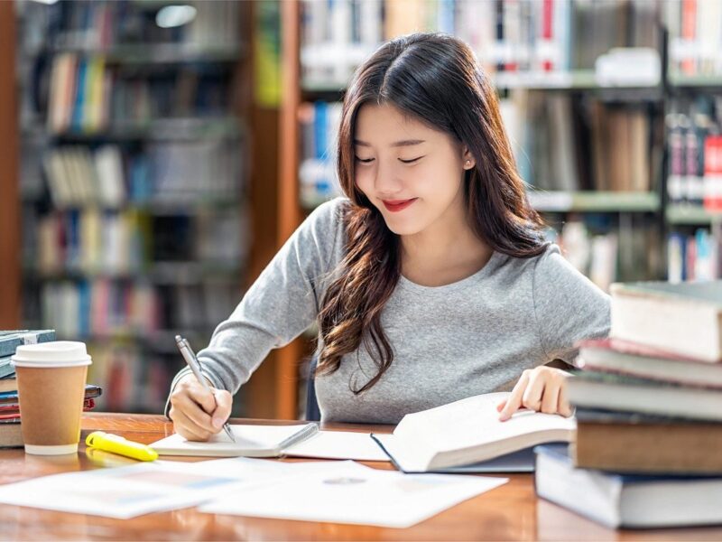 woman, writing, library