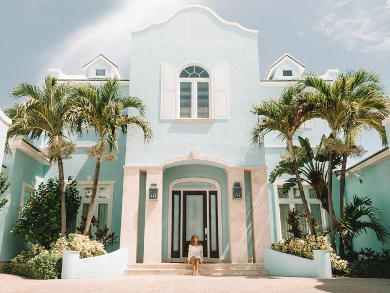 woman sitting in front of building