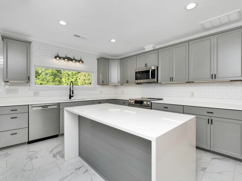 a kitchen with white cabinets