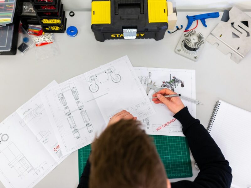 person holding white printer paper