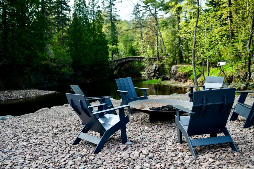 a group of chairs sitting around a fire pit