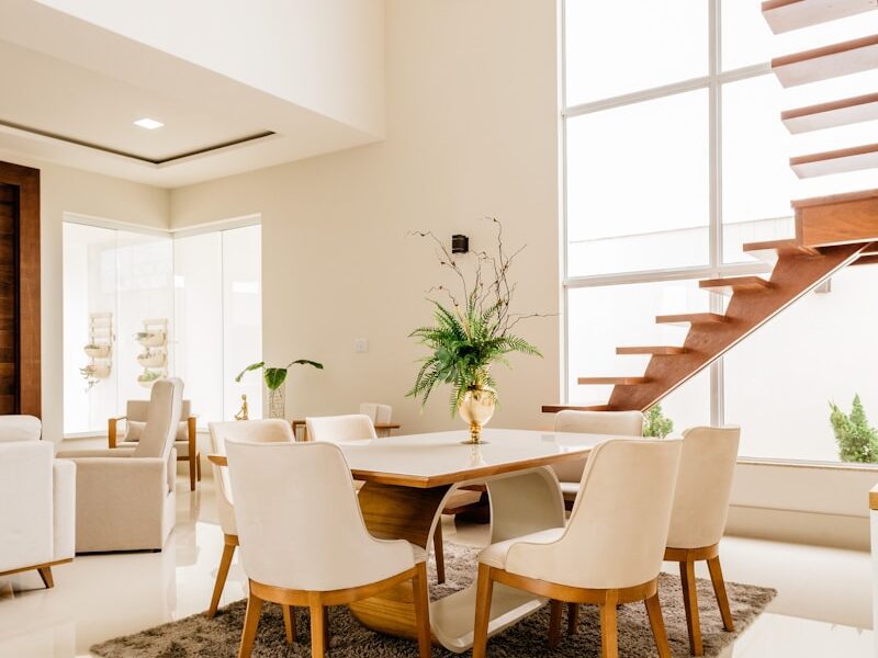 white and brown wooden table and chairs