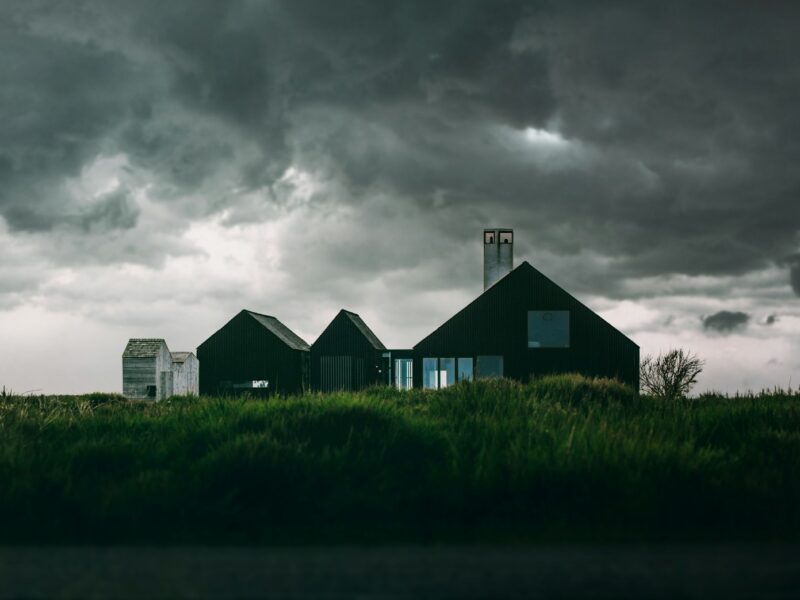 house underneath cumulus clouds