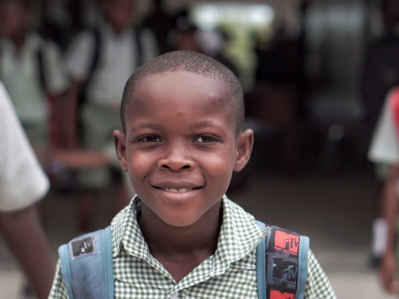 boy wearing blue backpack