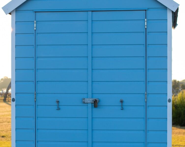 blue wooden tool shed
