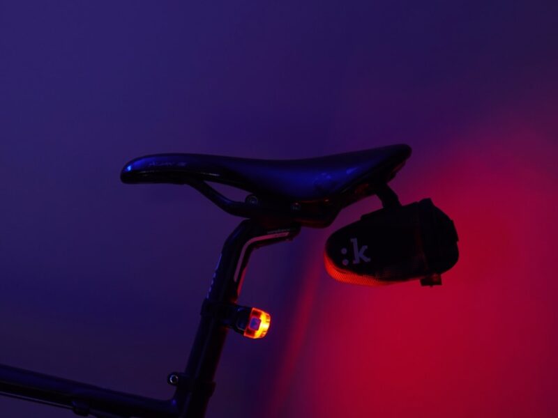 A bicycle is illuminated by a red light