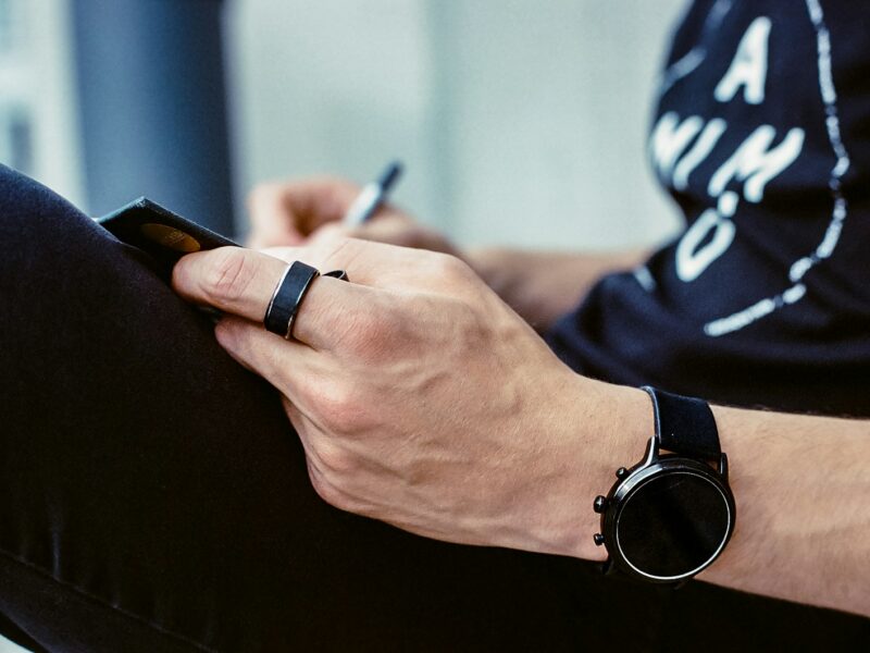 a person writing on a blackboard