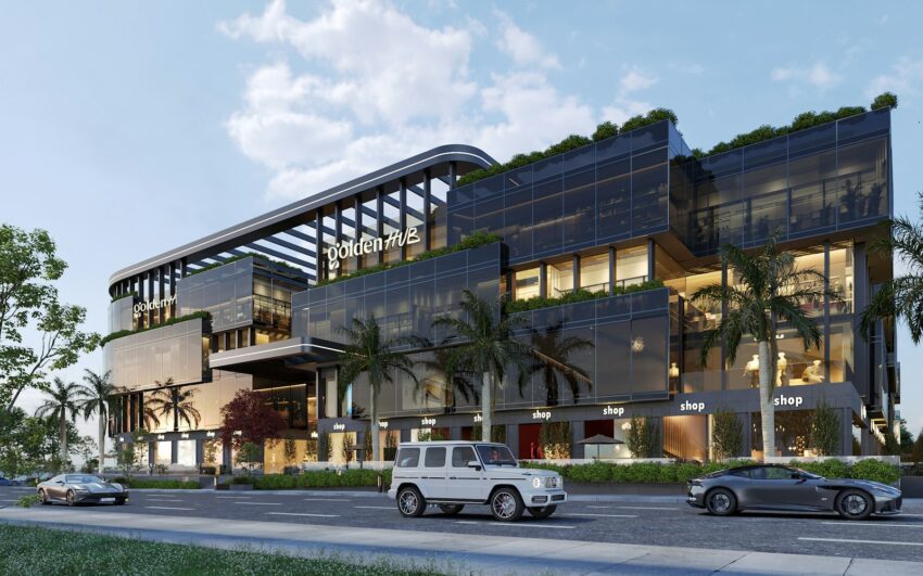 A large building with a lot of windows next to a street