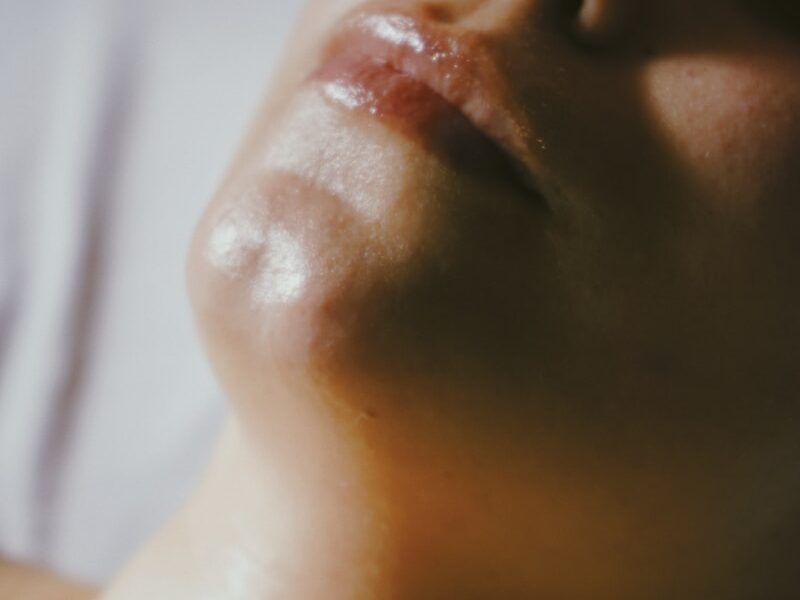 a woman getting a facial massage on her face