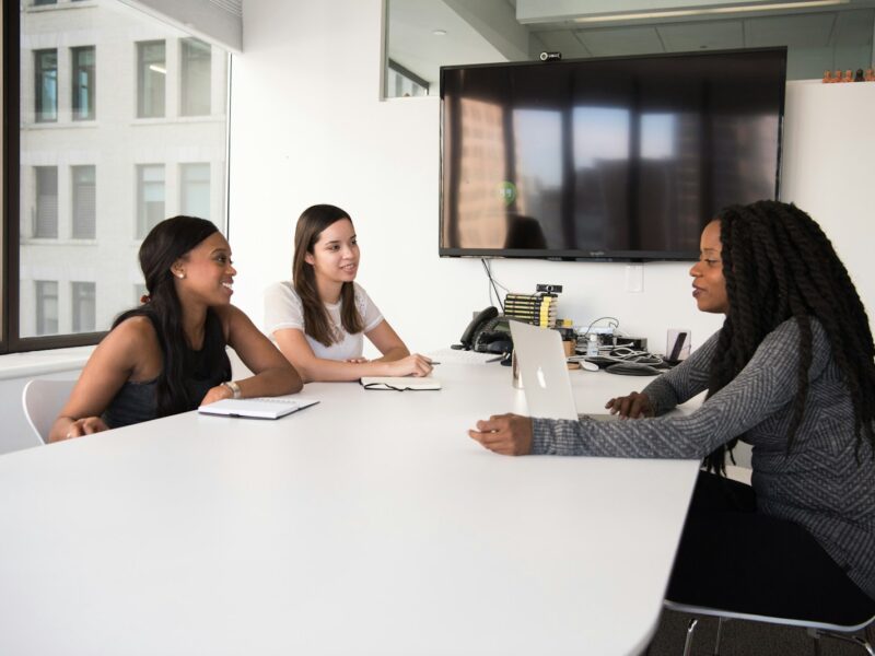 three women sitting at the table