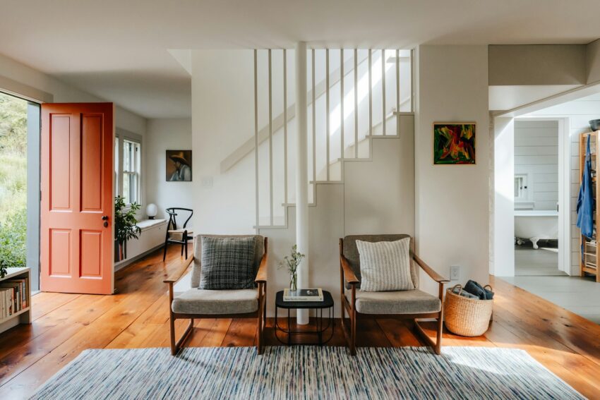 A living room filled with furniture and lots of windows