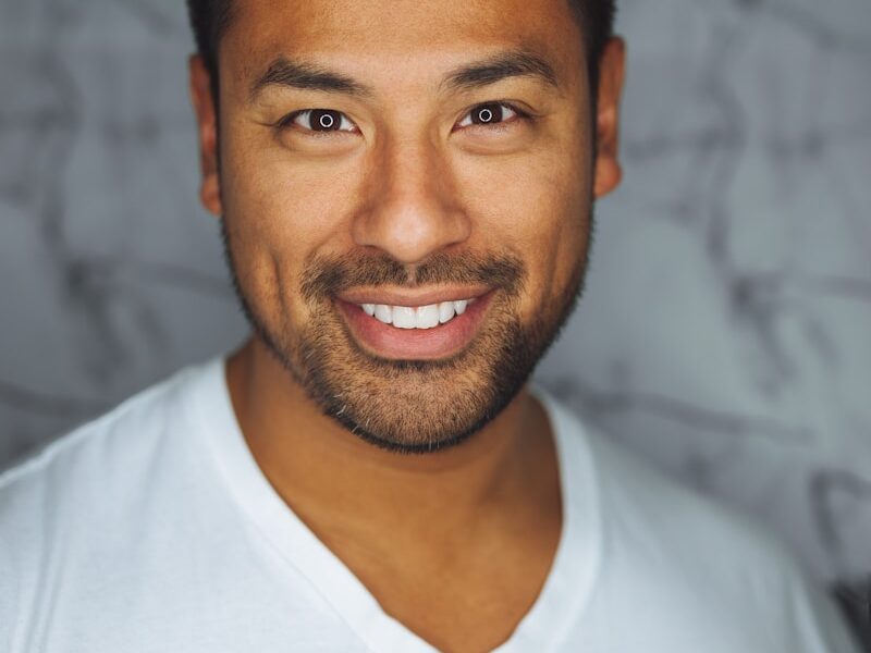 man wearing white V-neck shirt