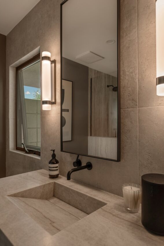 Modern bathroom sink with a large mirror above