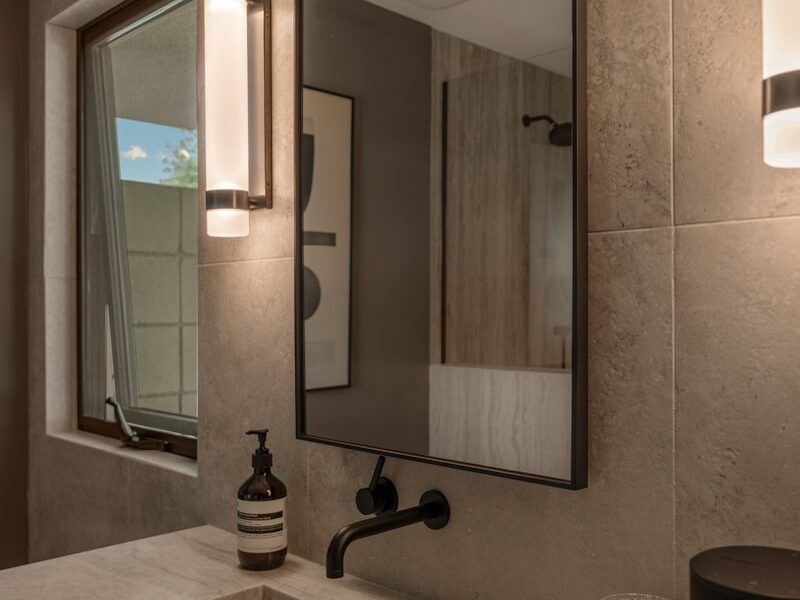 Modern bathroom sink with a large mirror above