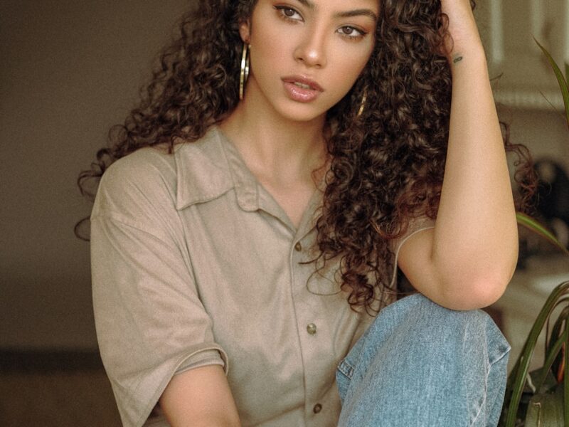 woman in brown button up shirt and blue denim jeans