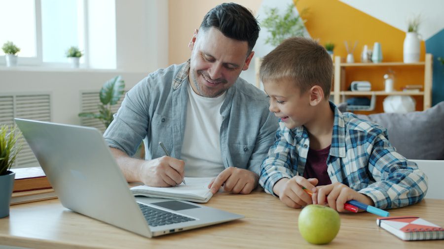 Father and son studying together at a desk.