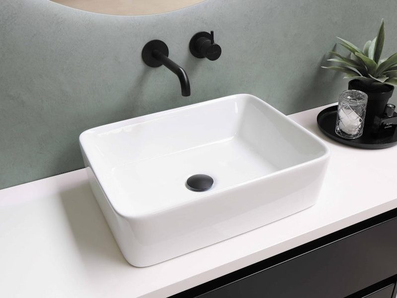 white ceramic sink with stainless steel faucet