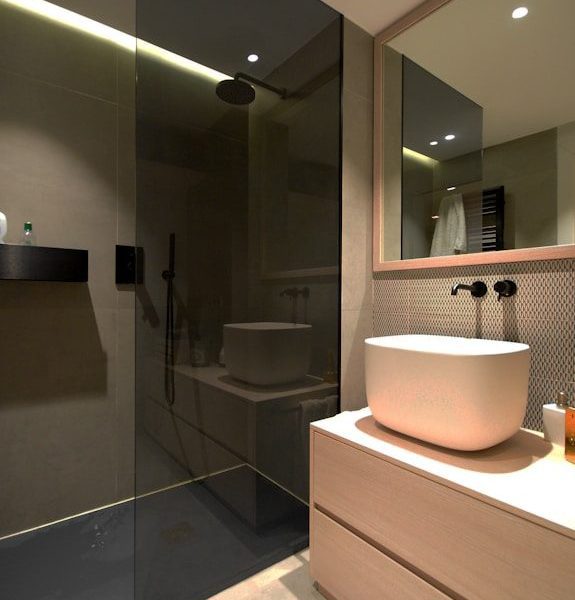 white ceramic sink near mirror