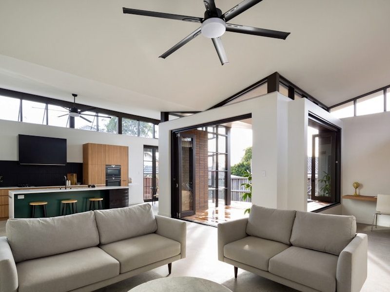 a living room with a large ceiling fan