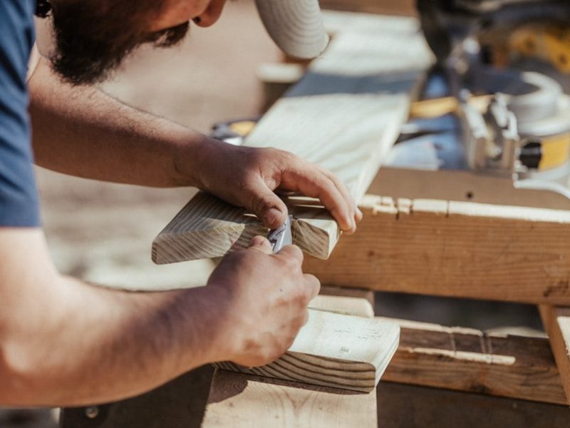 a man working on a piece of wood