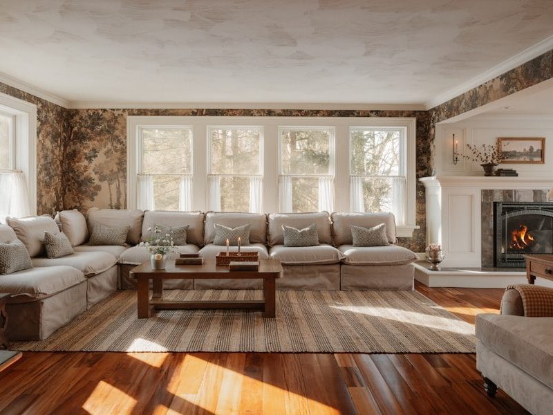 Cozy living room with sectional sofa and fireplace.