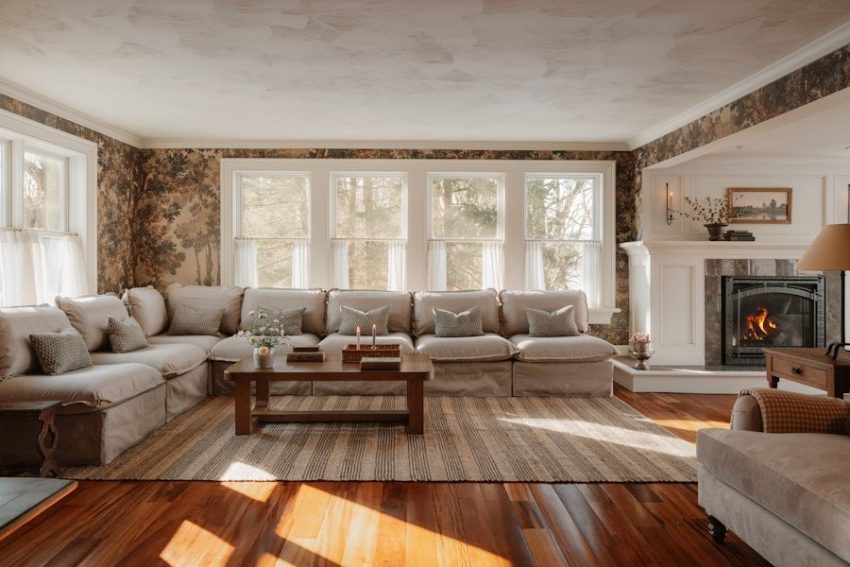 Cozy living room with sectional sofa and fireplace.