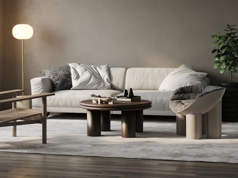 a living room with a couch, chair and table