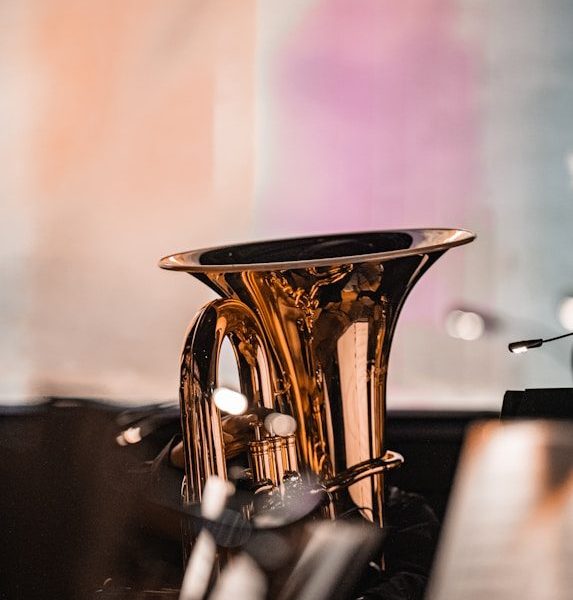 a gold trophy on a black surface