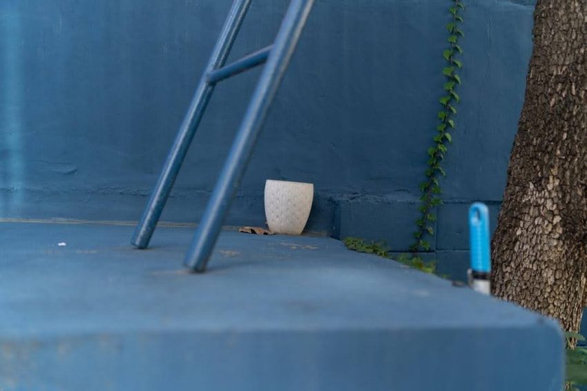 Pool pump and filter on a backyard equipment pad