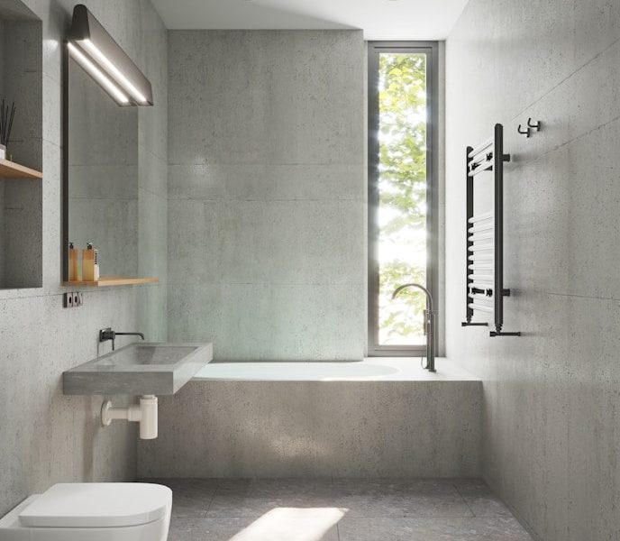 a bathroom with a toilet, sink, and bathtub