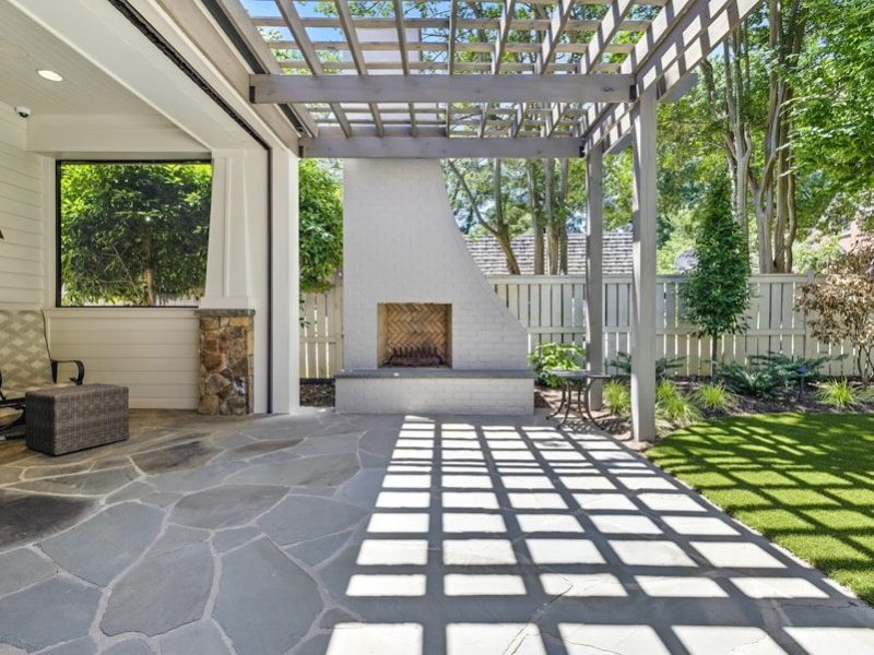 Outdoor patio with fireplace and pergola
